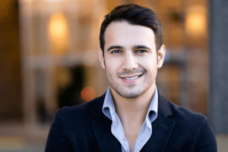 Professional man smiling in a relaxed setting, representing a confident, relationship-ready client